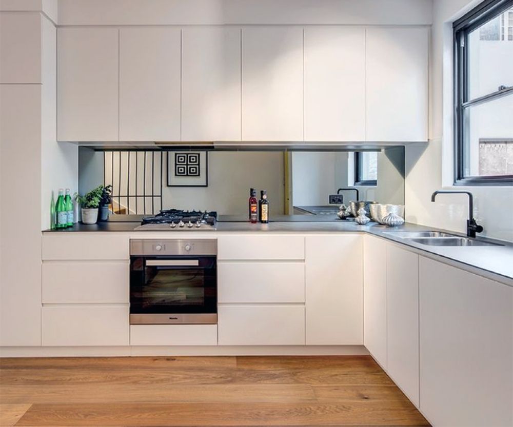 Make a small kitchen look bigger with mirror backsplash