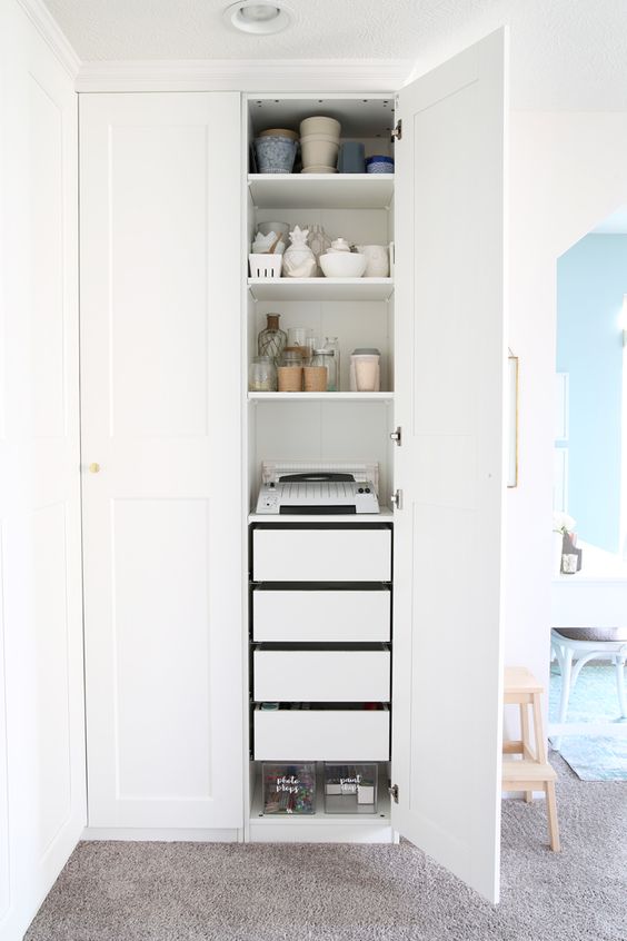 Ikea PAX wardrobe used as kitchen storeroom
