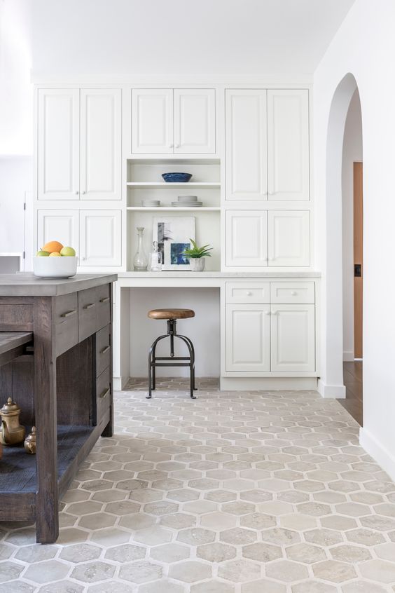 Geometric kitchen tiles and white cabinets