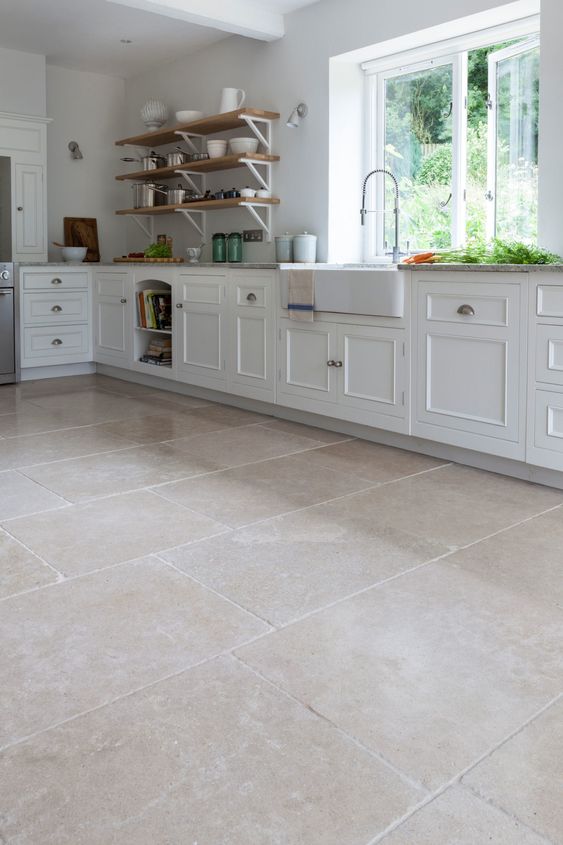 Stone creamy flooring visually expand kitchen space