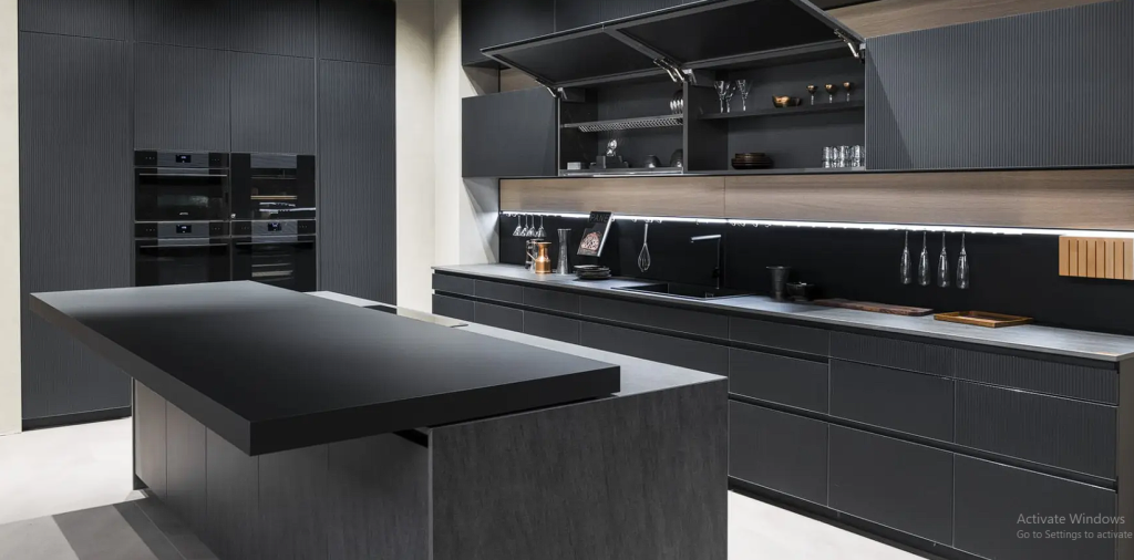 Black kitchen cabinets and grey kitchen countertops