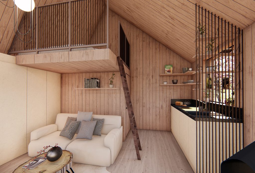 A look inside a wooden cabin house showing couch on the left, kichen on the right and a small stairs for the bedroom platform above the couch